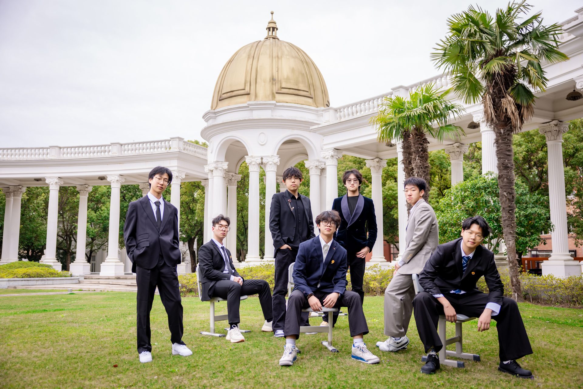 Students on the lawn in front of the colonnade at Boya International Academy